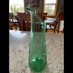 Blown glass pitcher.